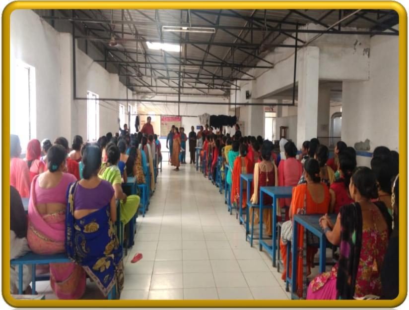 Industrial factory hall workforce attending legal rights and anti-harassment session