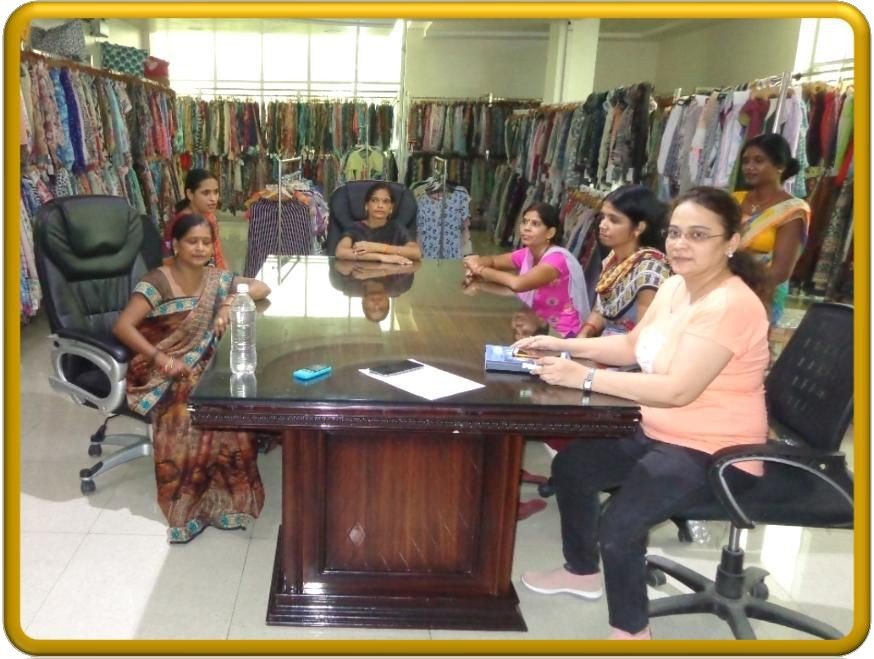 Garment showroom meeting with female workers and leaders
