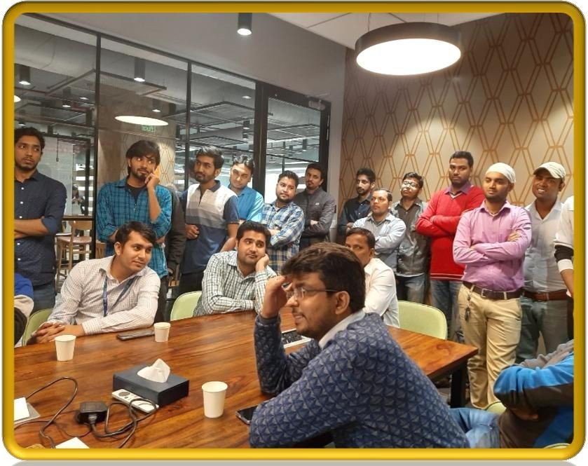 Male employees in conference room attending gender sensitization