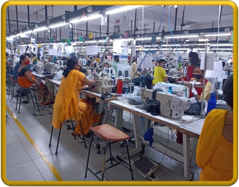 Industrial sewing floor with dozens of machine operators
