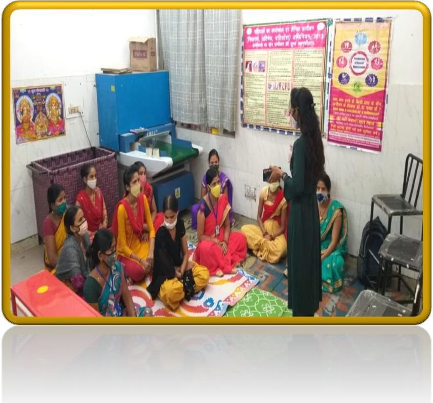 Women workers seated on mats attending POSH awareness